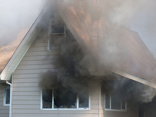 Smoke coming from window house fire